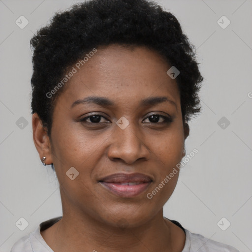 Joyful black young-adult female with short  black hair and brown eyes