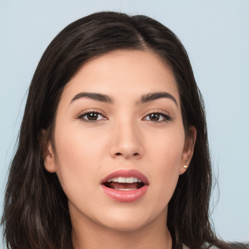 Joyful asian young-adult female with long  brown hair and brown eyes