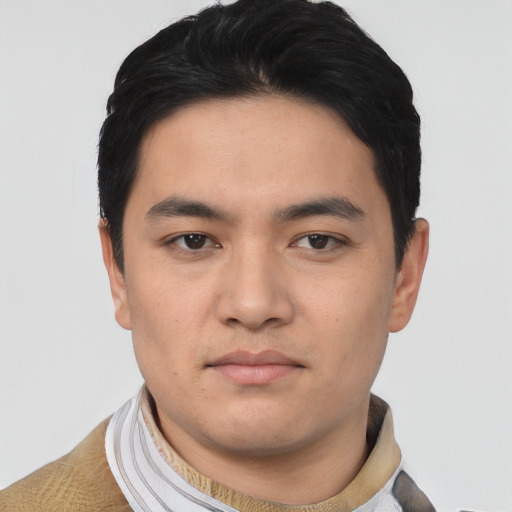 Joyful asian young-adult male with short  black hair and brown eyes