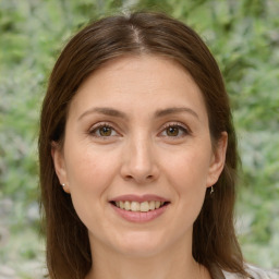 Joyful white adult female with medium  brown hair and brown eyes