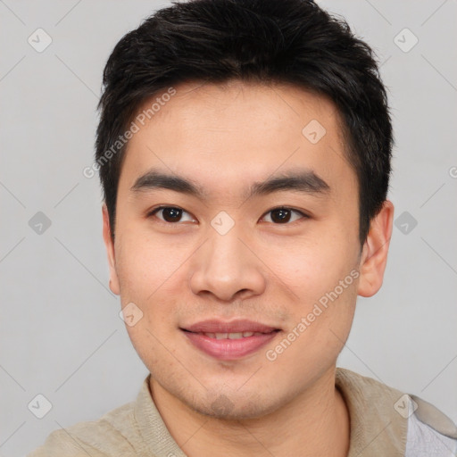 Joyful asian young-adult male with short  brown hair and brown eyes