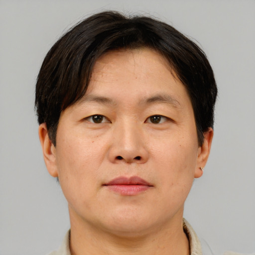 Neutral asian adult male with short  brown hair and brown eyes