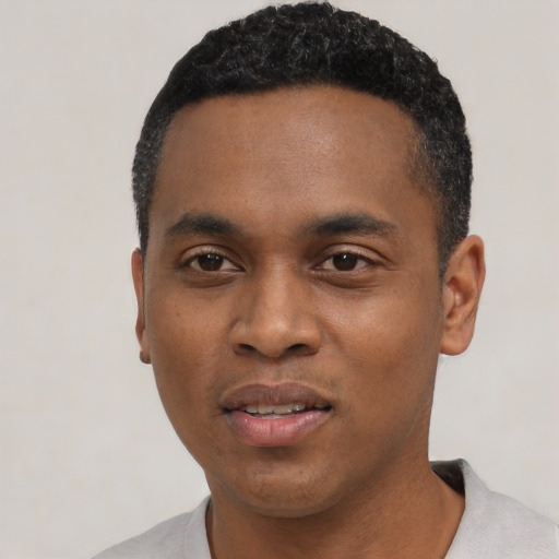 Neutral black young-adult male with short  black hair and brown eyes
