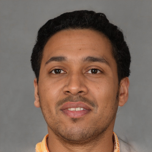 Neutral latino young-adult male with short  black hair and brown eyes