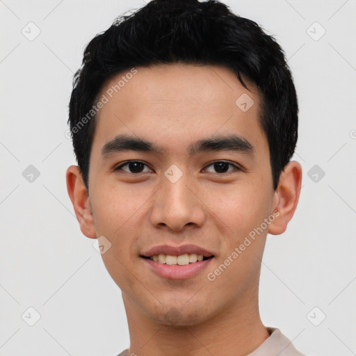 Joyful asian young-adult male with short  black hair and brown eyes