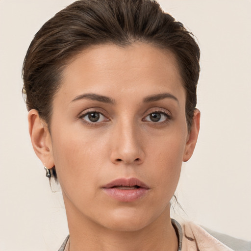 Neutral white young-adult female with short  brown hair and brown eyes