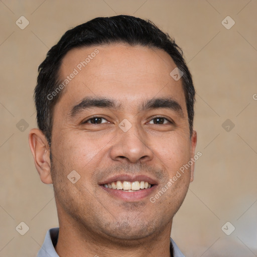 Joyful white young-adult male with short  black hair and brown eyes