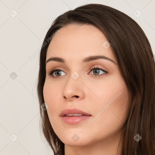 Neutral white young-adult female with long  brown hair and brown eyes