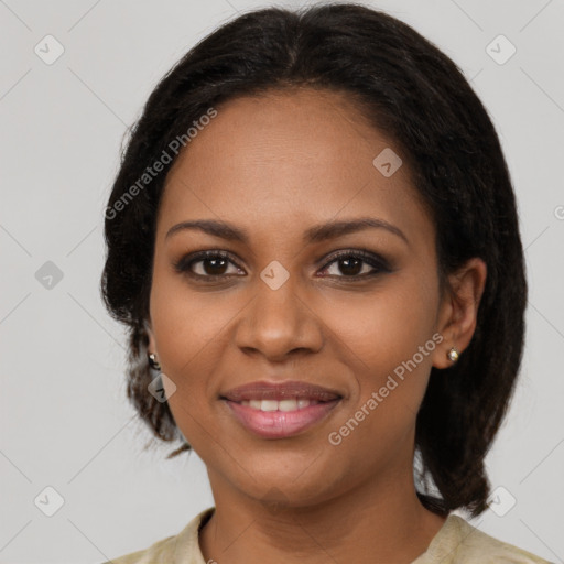 Joyful black young-adult female with medium  brown hair and brown eyes