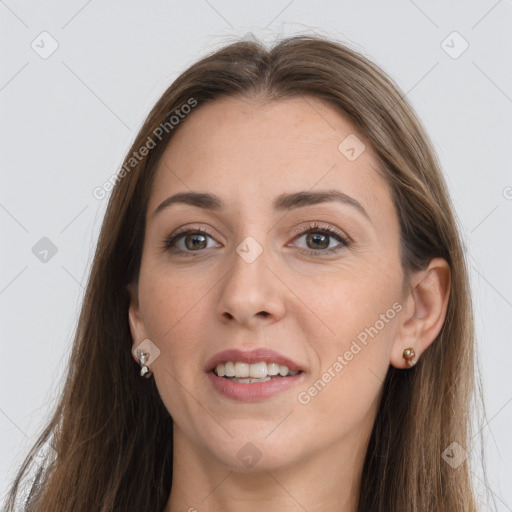 Joyful white young-adult female with long  brown hair and grey eyes