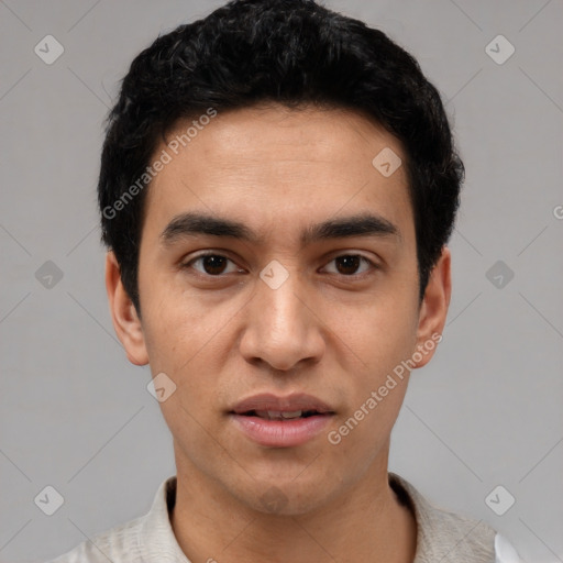 Neutral white young-adult male with short  black hair and brown eyes