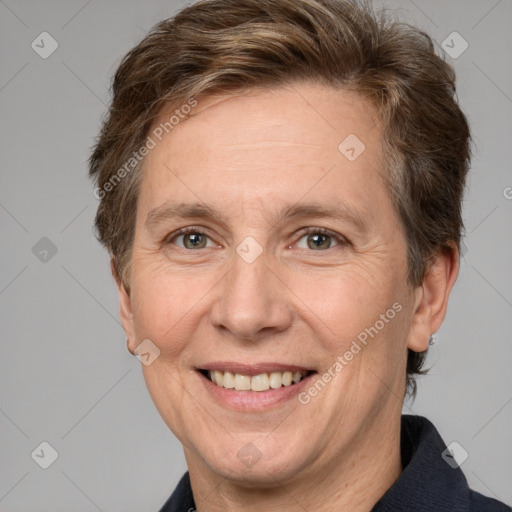 Joyful white adult female with short  brown hair and grey eyes