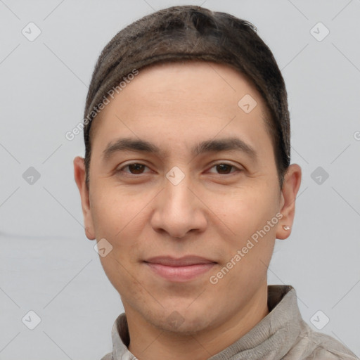 Joyful white young-adult male with short  black hair and brown eyes