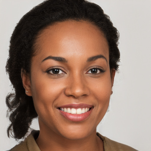 Joyful latino young-adult female with long  brown hair and brown eyes