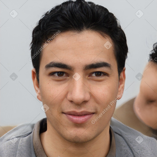 Joyful asian young-adult male with short  brown hair and brown eyes