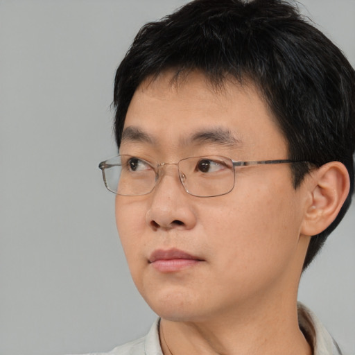 Neutral asian young-adult male with short  brown hair and brown eyes