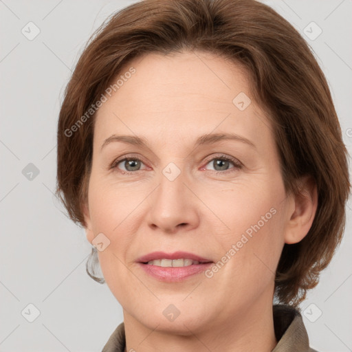 Joyful white adult female with medium  brown hair and grey eyes