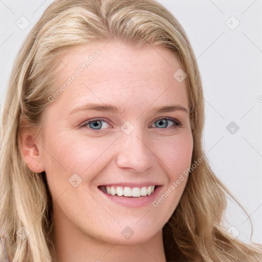 Joyful white young-adult female with long  brown hair and blue eyes