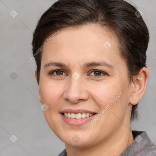 Joyful white adult female with short  brown hair and brown eyes