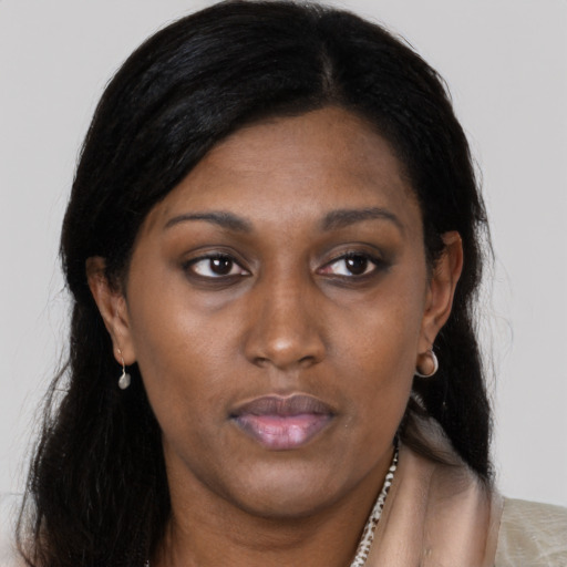 Neutral black adult female with long  brown hair and brown eyes