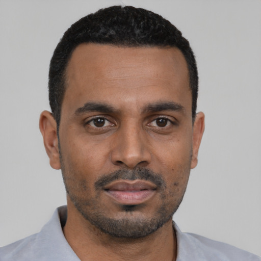 Neutral black young-adult male with short  black hair and brown eyes