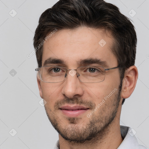 Joyful white adult male with short  brown hair and brown eyes