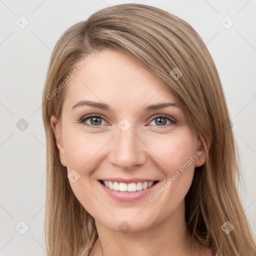 Joyful white young-adult female with long  brown hair and grey eyes