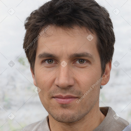 Joyful white adult male with short  brown hair and brown eyes