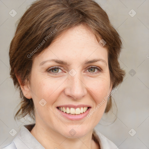 Joyful white adult female with medium  brown hair and blue eyes