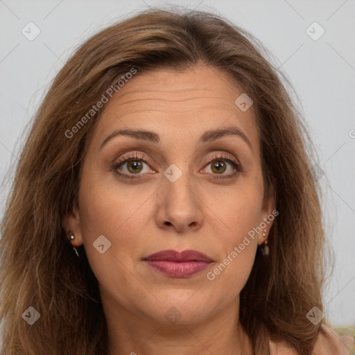 Joyful white adult female with long  brown hair and brown eyes