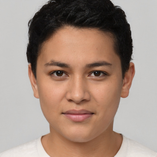 Joyful latino young-adult female with short  brown hair and brown eyes