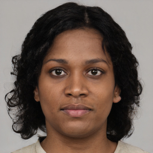Neutral black young-adult female with medium  black hair and brown eyes