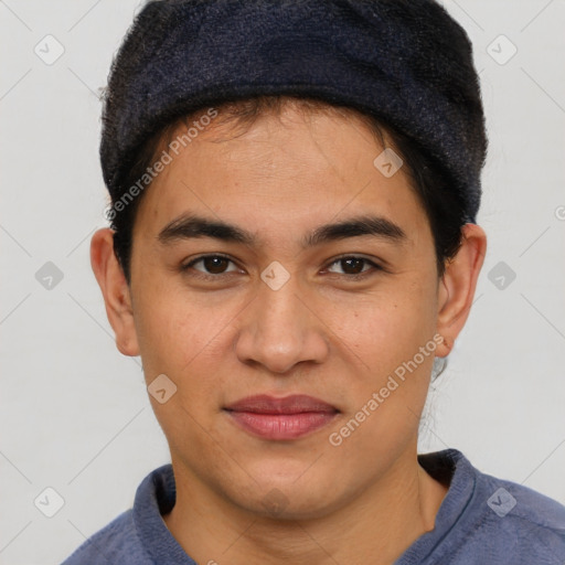 Joyful latino young-adult male with short  brown hair and brown eyes