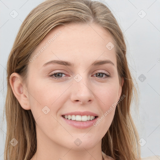 Joyful white young-adult female with long  brown hair and blue eyes