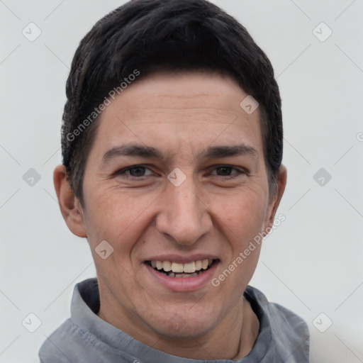 Joyful white young-adult male with short  black hair and brown eyes