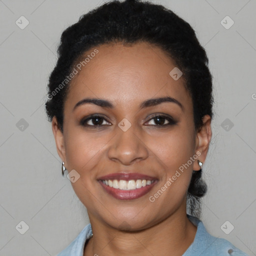 Joyful latino young-adult female with short  black hair and brown eyes