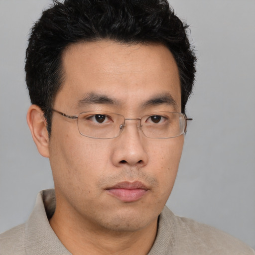 Neutral asian young-adult male with short  brown hair and brown eyes