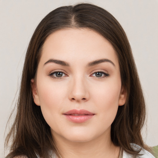 Neutral white young-adult female with long  brown hair and brown eyes