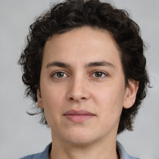 Joyful white young-adult male with medium  brown hair and brown eyes