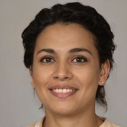 Joyful white young-adult female with medium  brown hair and brown eyes