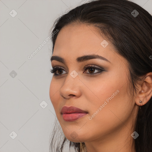 Joyful latino young-adult female with long  brown hair and brown eyes