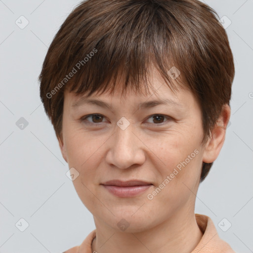 Joyful white adult female with short  brown hair and brown eyes