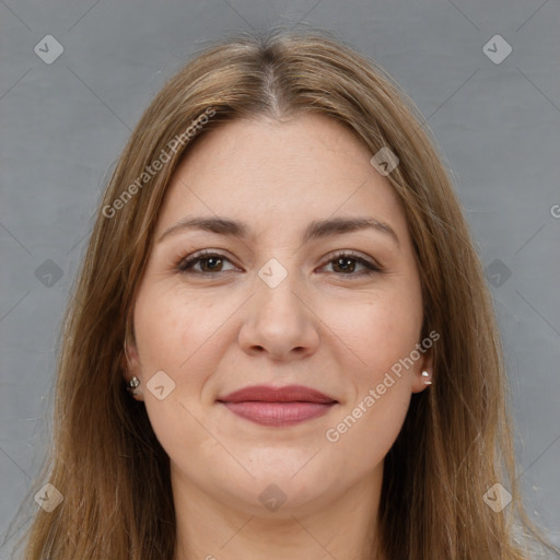 Joyful white young-adult female with long  brown hair and brown eyes