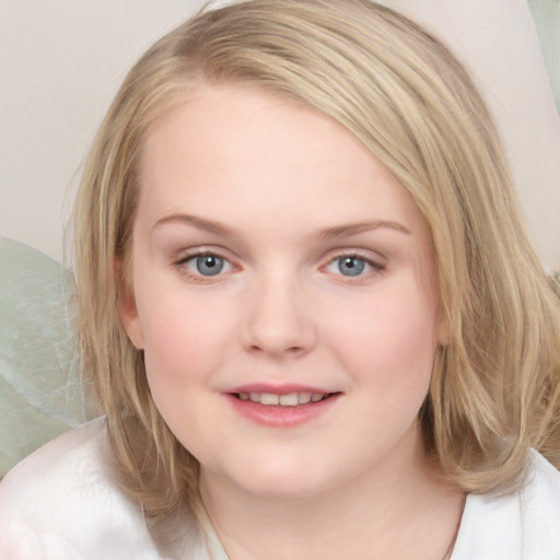 Joyful white child female with medium  brown hair and blue eyes