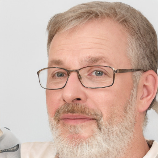 Neutral white middle-aged male with short  gray hair and blue eyes