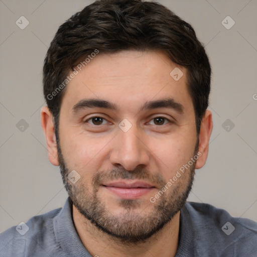 Joyful white young-adult male with short  black hair and brown eyes