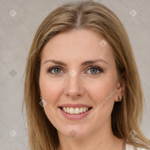 Joyful white young-adult female with long  brown hair and green eyes