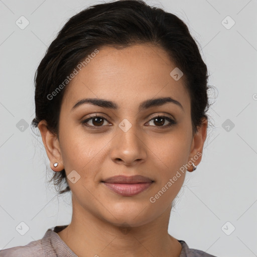 Joyful latino young-adult female with medium  brown hair and brown eyes