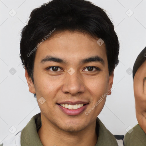 Joyful asian young-adult male with short  brown hair and brown eyes