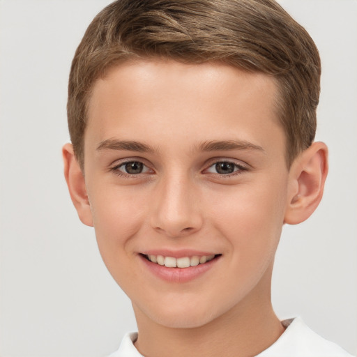 Joyful white child male with short  brown hair and brown eyes